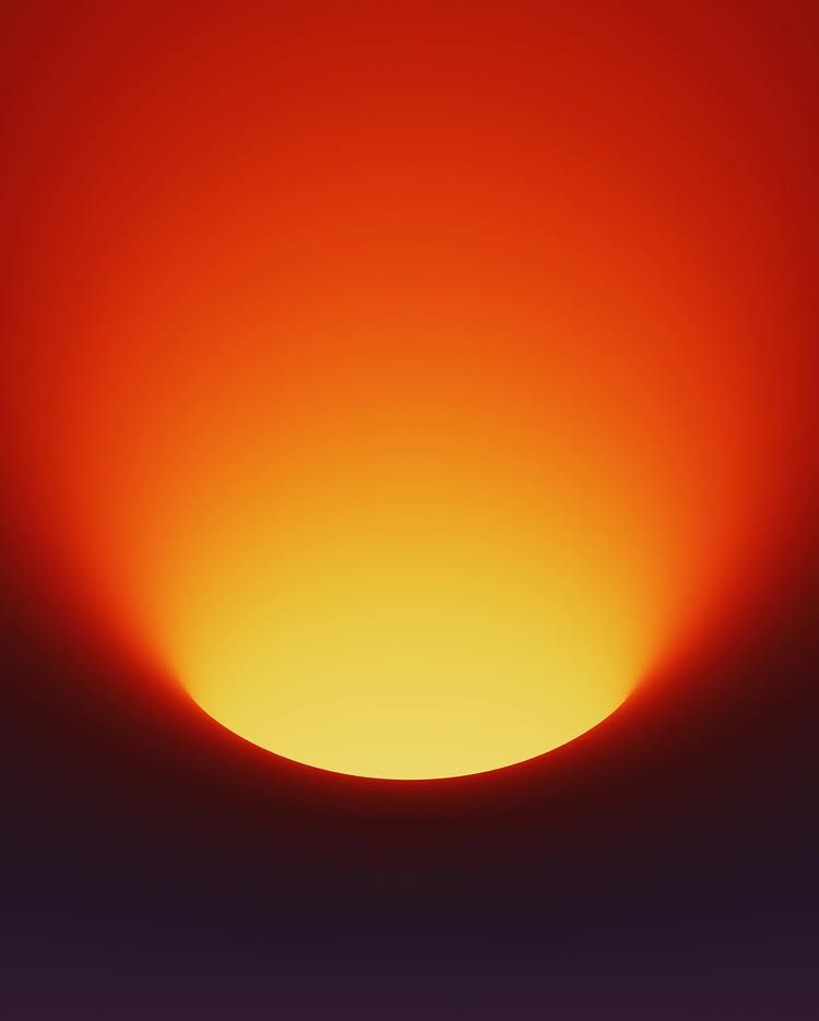 Abstract orange sun glowing against a dark red background in a cinematic campaign visual.