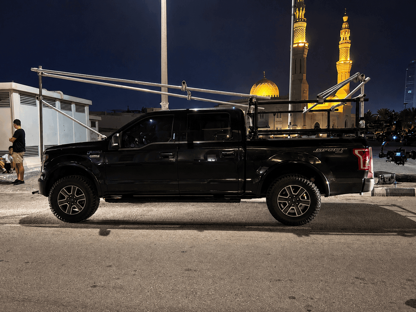 Camera car and pickup rig prepared for nighttime automotive filming
