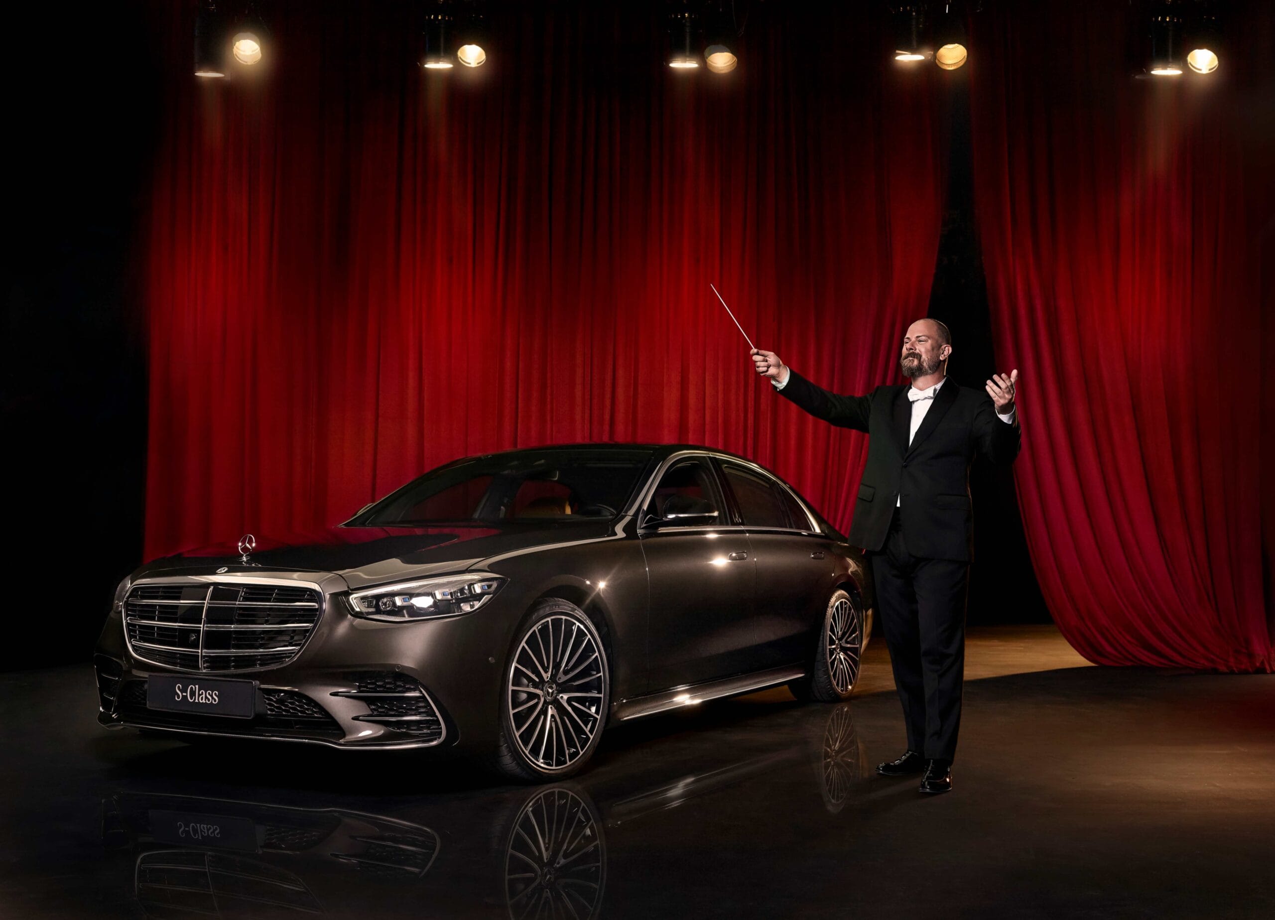 Mercedes-Benz S-Class beside a conductor on stage for The Maestro’s Journey automotive campaign.