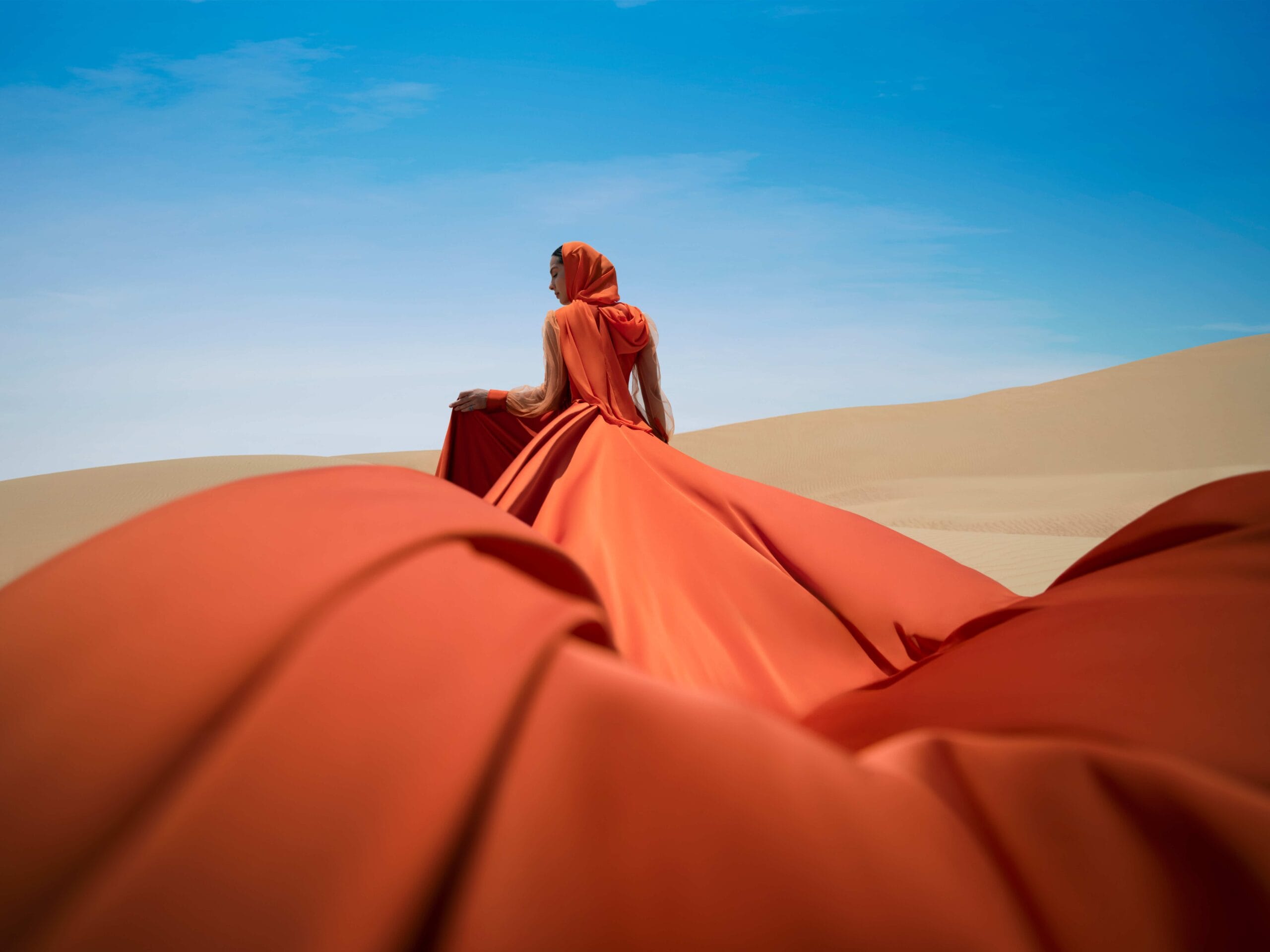 Arista Properties luxury real estate campaign featuring a lone figure and horse in the Dubai desert.