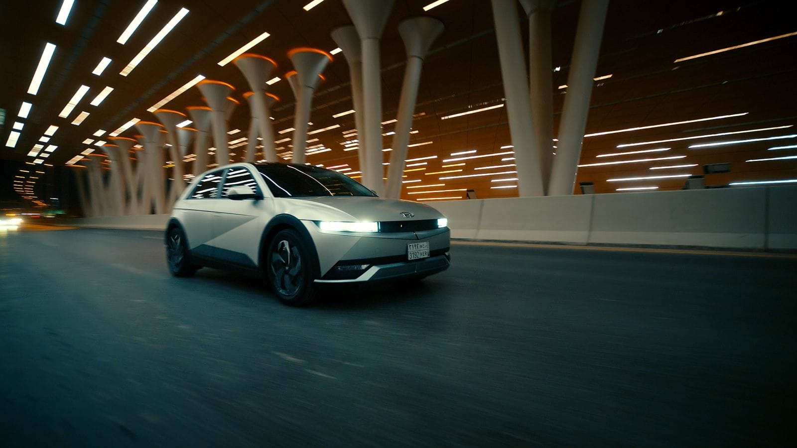Hyundai Ioniq 5 driving at night through a modern tunnel in Riyadh, Saudi Arabia