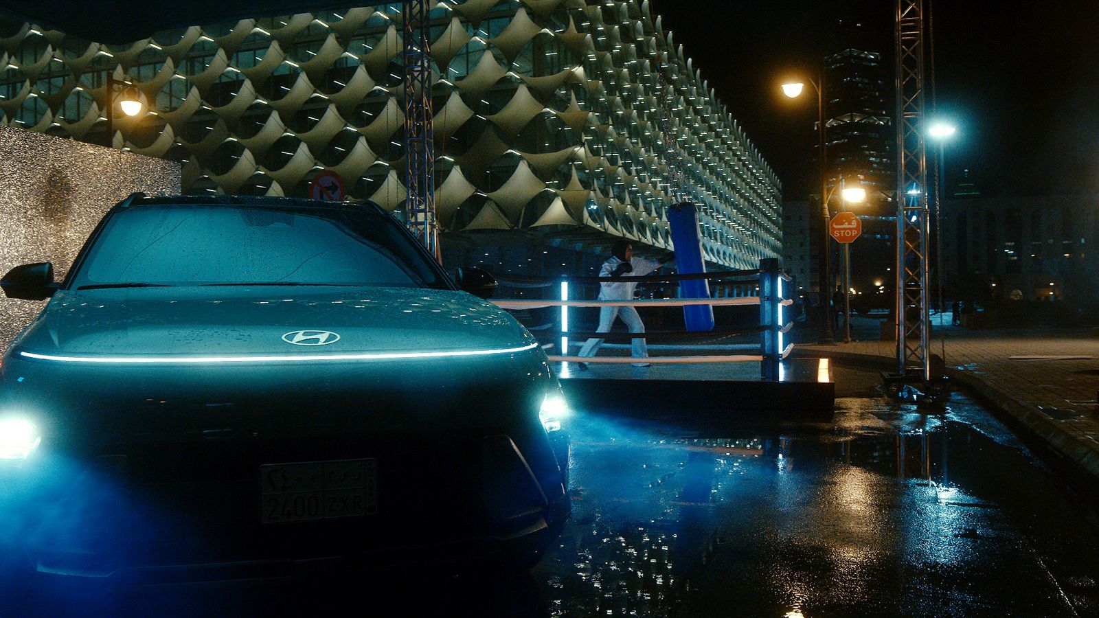 Hyundai Tucson parked at night during a boxing campaign in Riyadh, Saudi Arabia