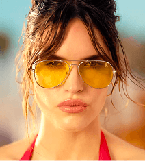 Woman wearing yellow sunglasses and a red halter top