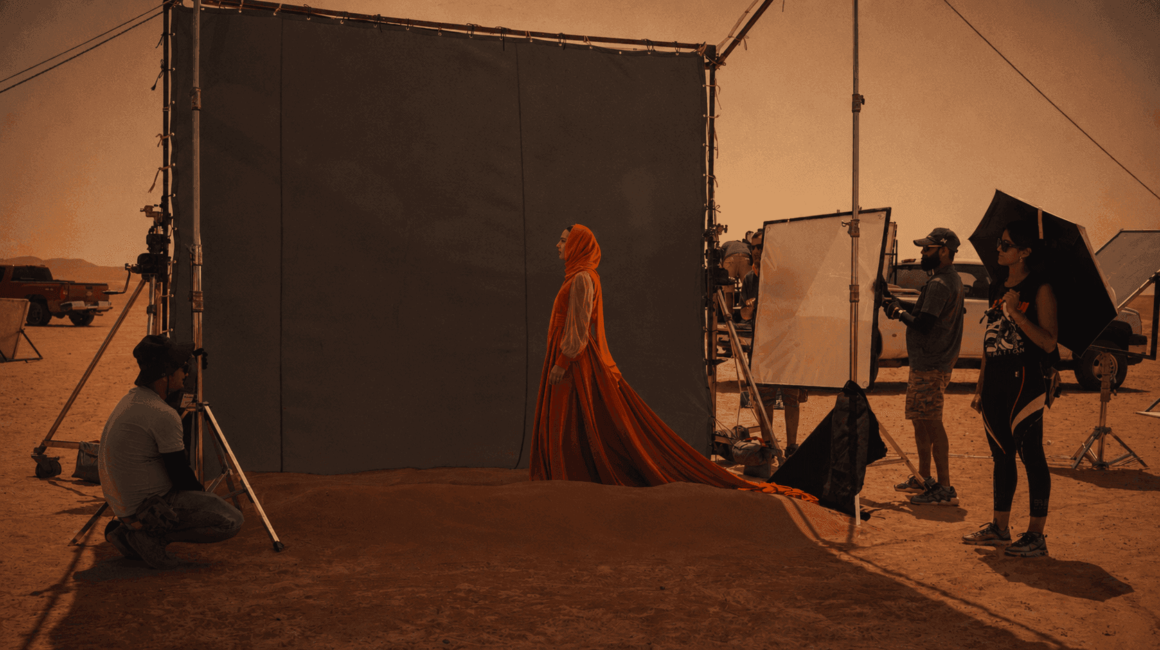 Toosuns campaign production set in the UAE desert with a model, film crew, cameras and lighting equipment.