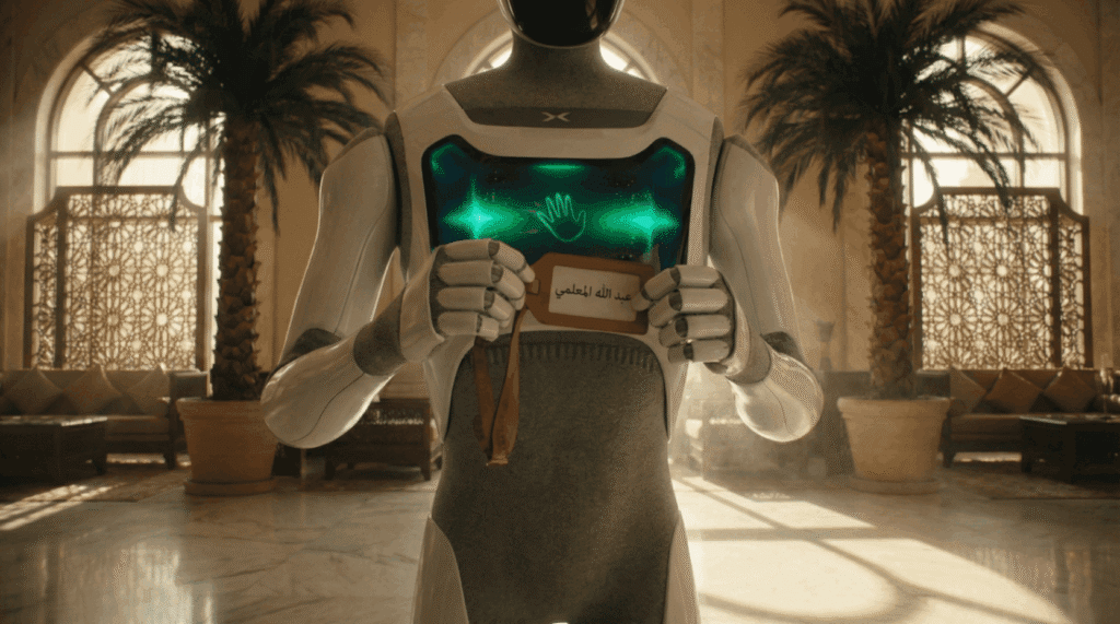 Humanoid service robot holding a guest name card in a luxury hotel, from the Abu Dhabi Robotics AI brand film.
