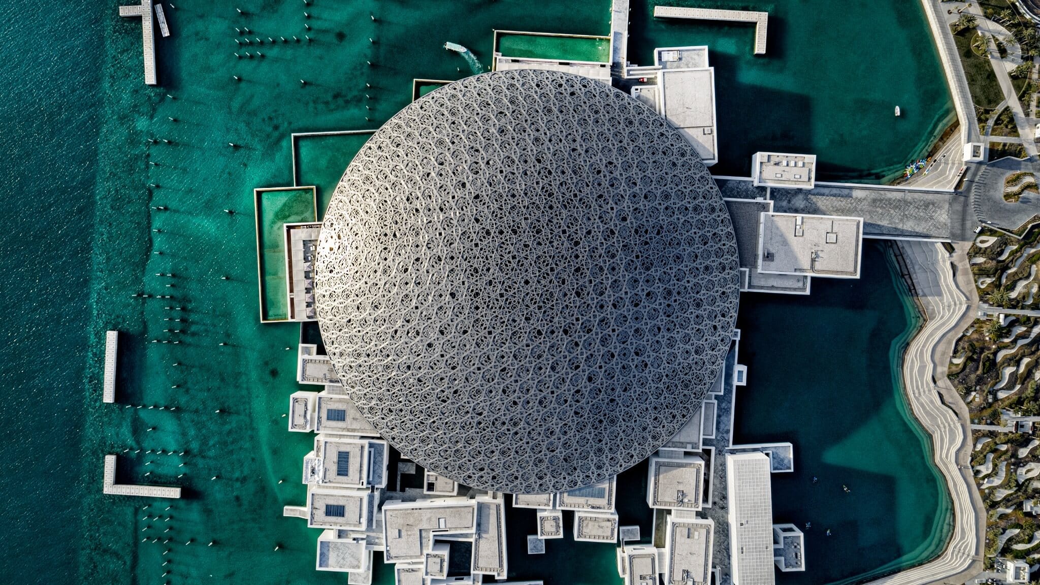 Aerial architectural view of Louvre Abu Dhabi and its distinctive dome.