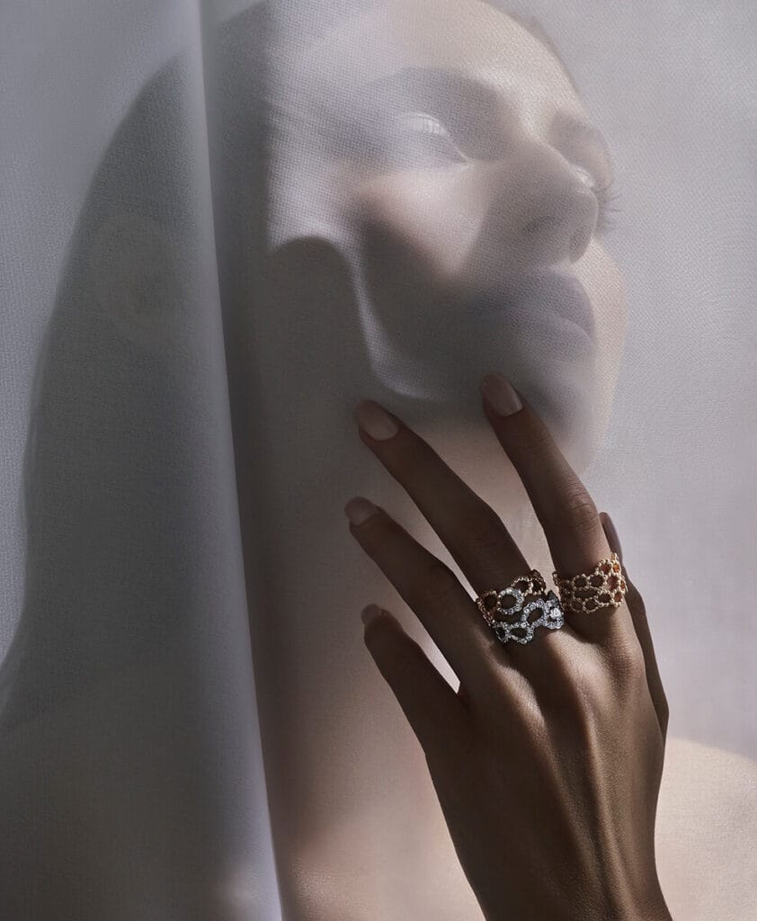 Luxury jewellery editorial featuring a styled collection of statement rings.