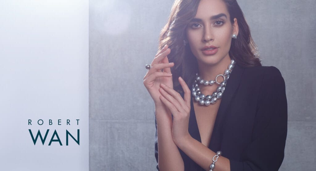 Robert Wan pearl jewellery campaign with an elegant luxury editorial composition.