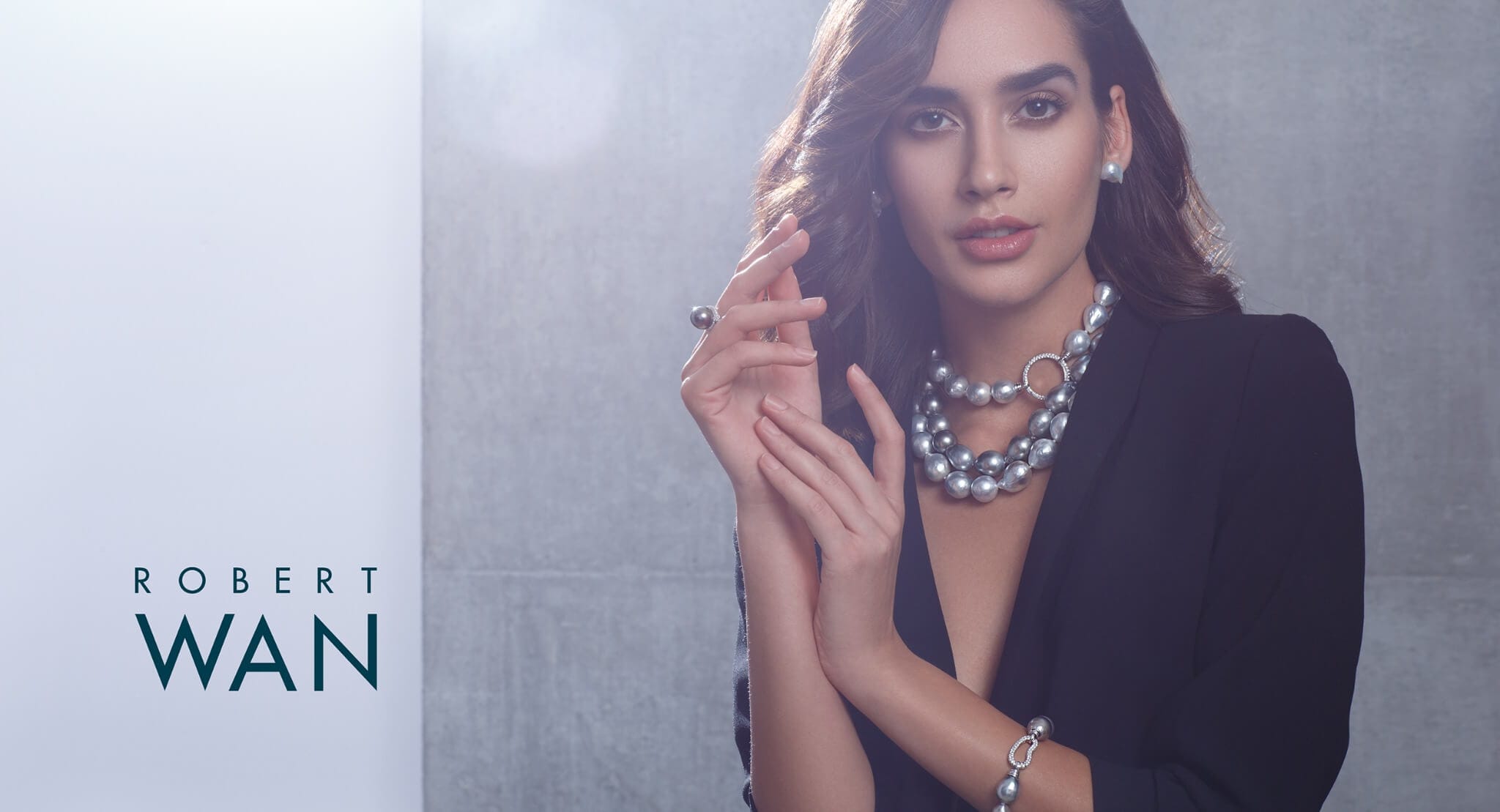 Robert Wan pearl jewellery campaign with an elegant luxury editorial composition.